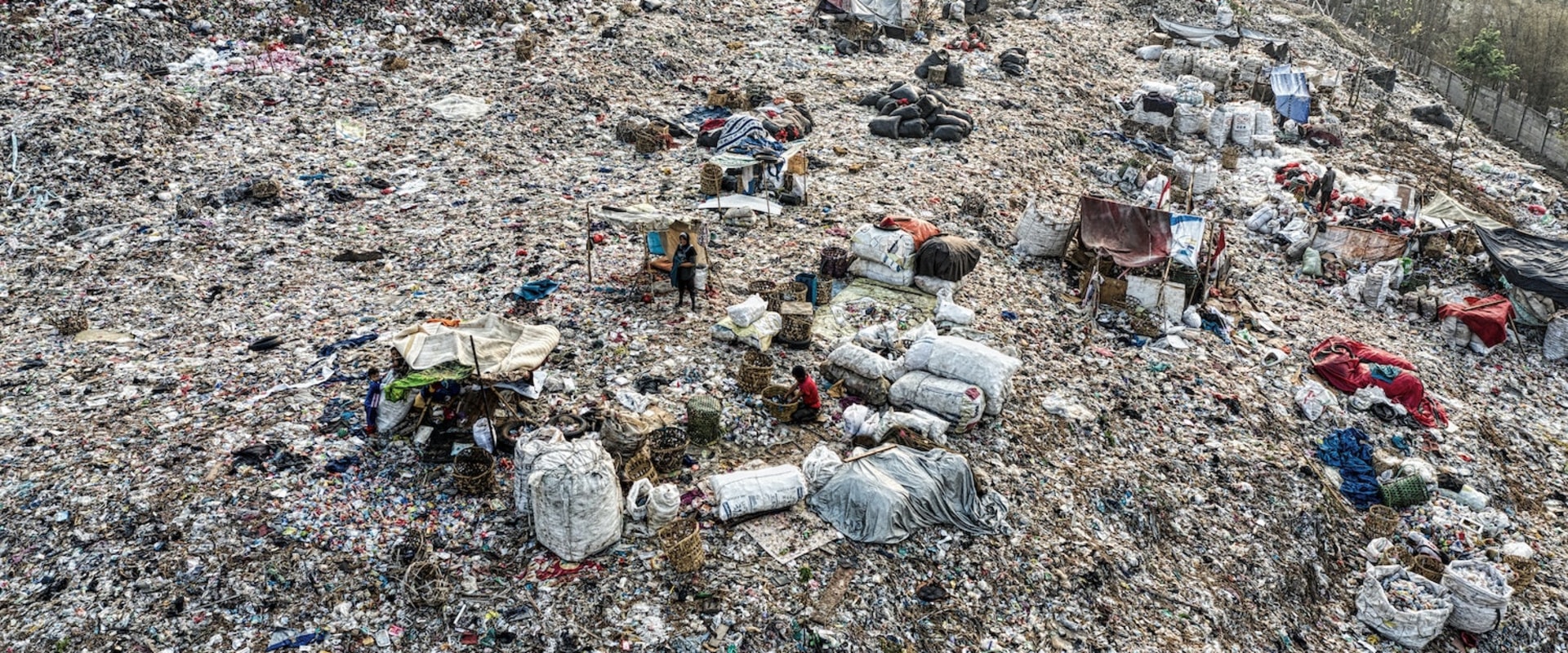 What happens to the waste after it goes to the landfill?